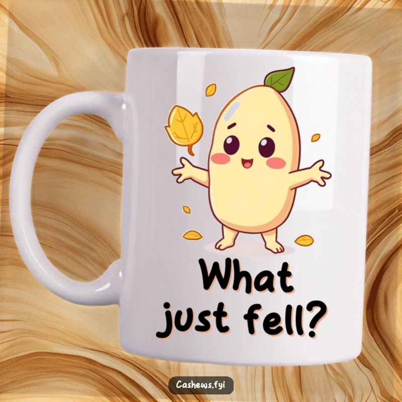 Funny ceramic mug showing a kawaii cashew character with arms wide, looking utterly surprised as a single leaf falls nearby.