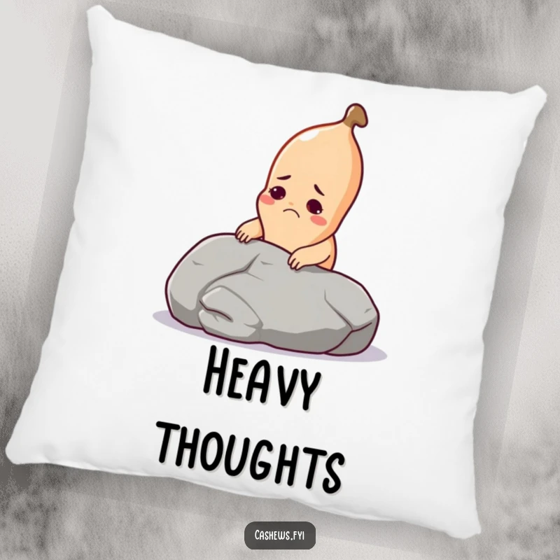 Funny cashew pillow featuring a cashew straining to lift a giant pebble, providing humorous comfort and decor.