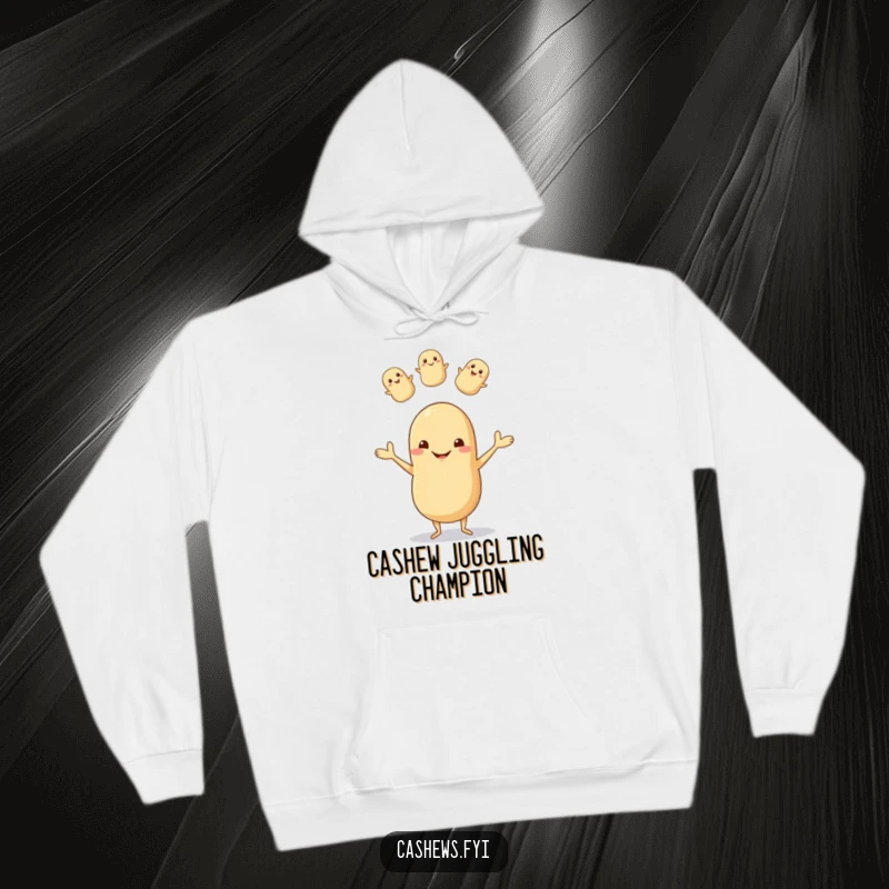 Funny hoodie featuring a happy cashew with tiny legs juggling nuts, exuding pure joy and a goofy grin, ideal for cozy fun.