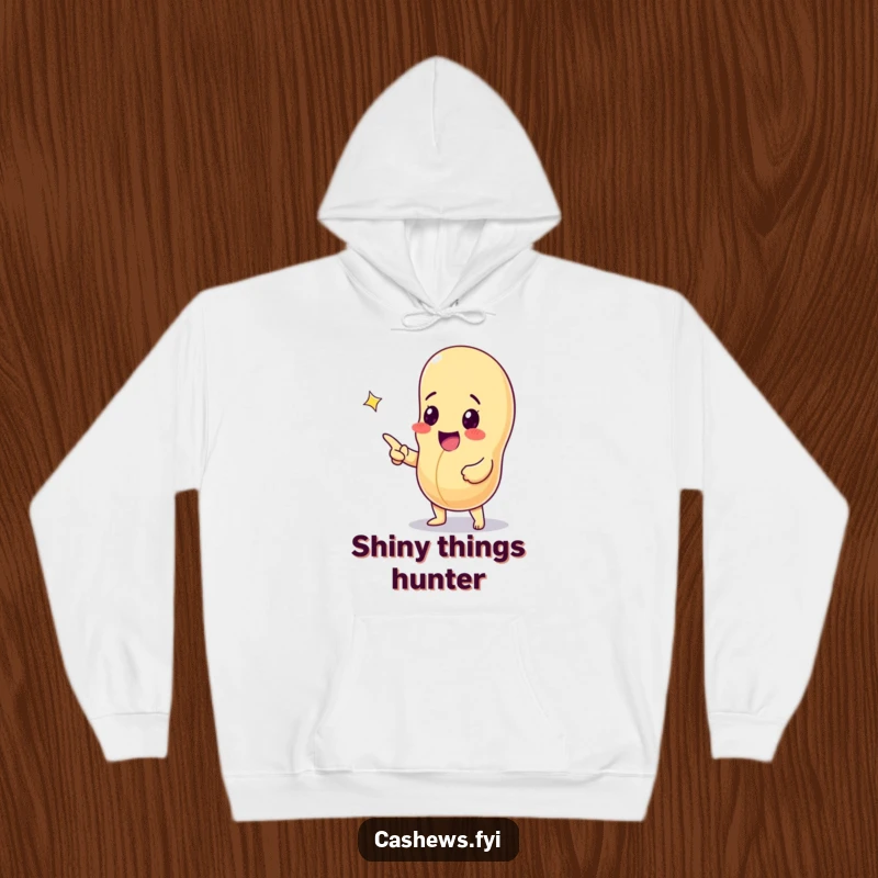 Funny hoodie depicting an excited cashew nut pointing at a sparkling gem, offering warm and humorous celebration of discovery.