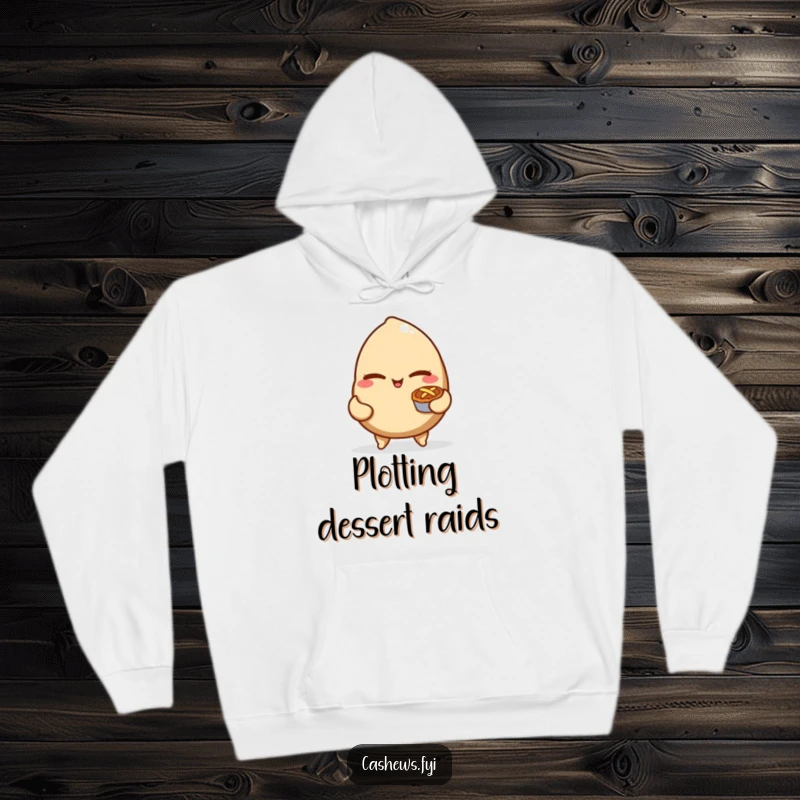 Funny hoodie depicting a mischievous cashew nut winking and holding a tiny pie, offering warm and humorous comfort.