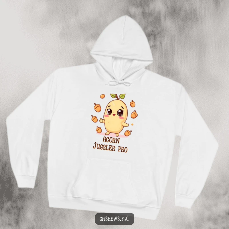Funny hoodie illustration of a kawaii cashew character with wide eyes, gleefully juggling acorns, exuding pure joy and cuteness.