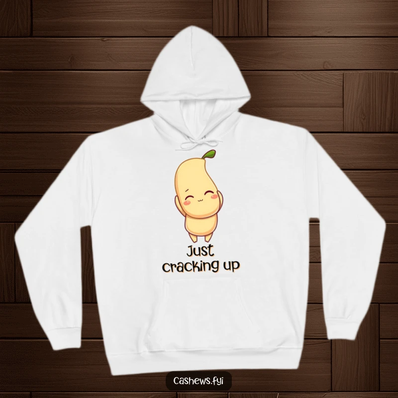 Funny hoodie depicting a cheerful, winking cashew character triumphantly holding a bright, glowing cashew, radiating nutty good vibes.