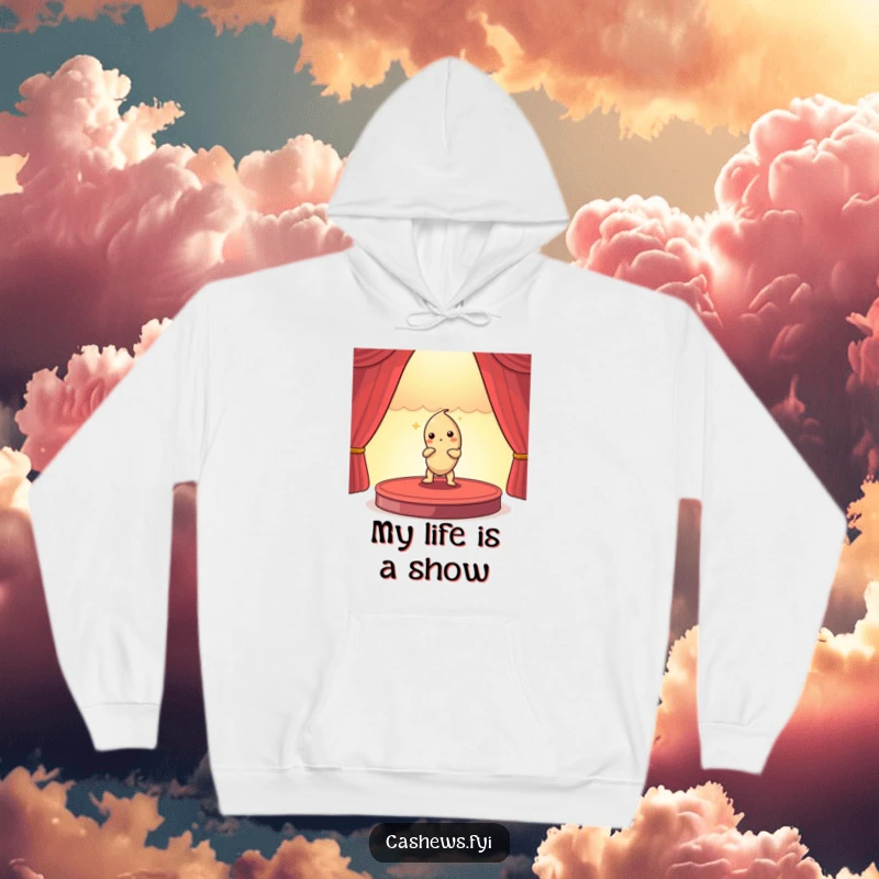Funny hoodie depicting a cashew nut actor posing dramatically on a miniature stage, offering warm and humorous comfort.